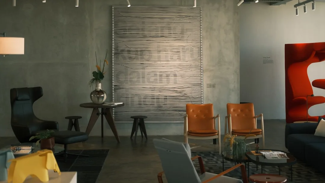 A living room filled with furniture and a painting on the wall